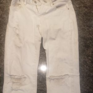 A levi white shinny ripped jeans